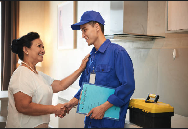 Plumber greeting customer