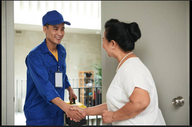Plumber with satisfied customer